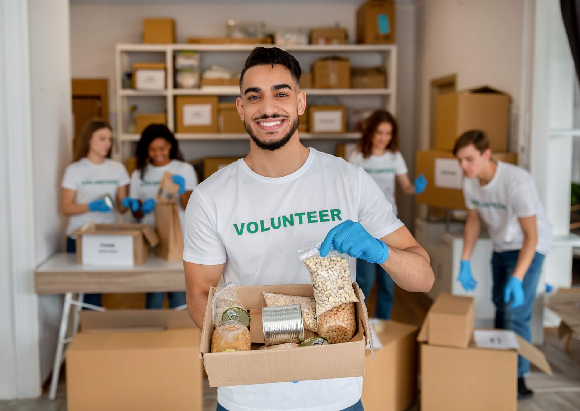 How to raise money online: 6 easy steps you should follow young arab volunteer working at charity center ho 2022 12 16 07 56 38 utc