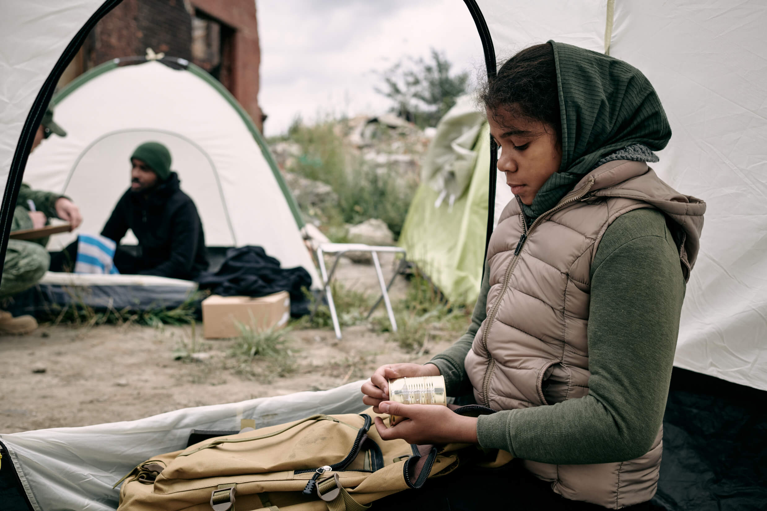 hungry african girl holding canned food while sitt fs9pspd.jpg