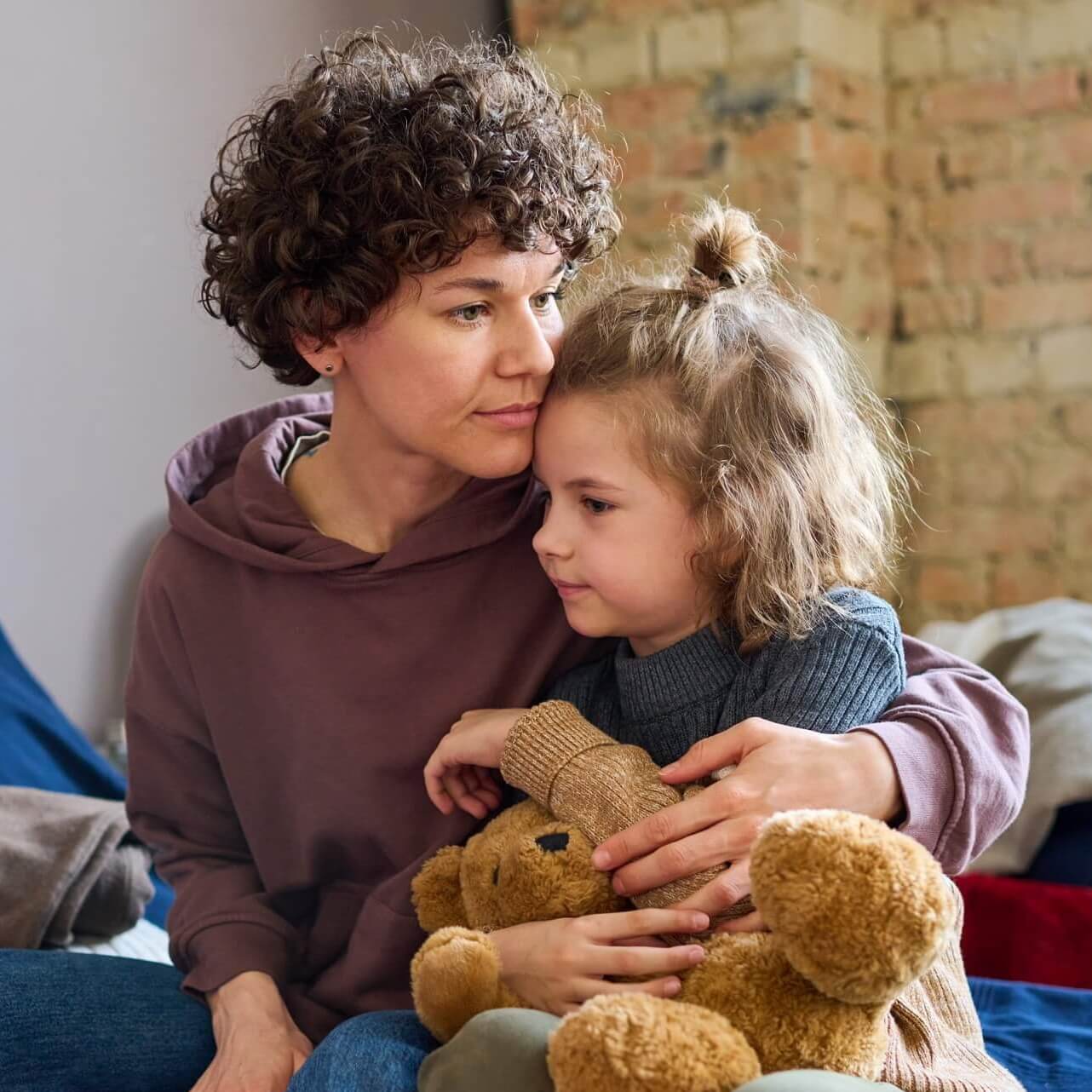 young woman giving hug to her cute little son with 2022 05 10 07 20 14 utc cropped.jpg
