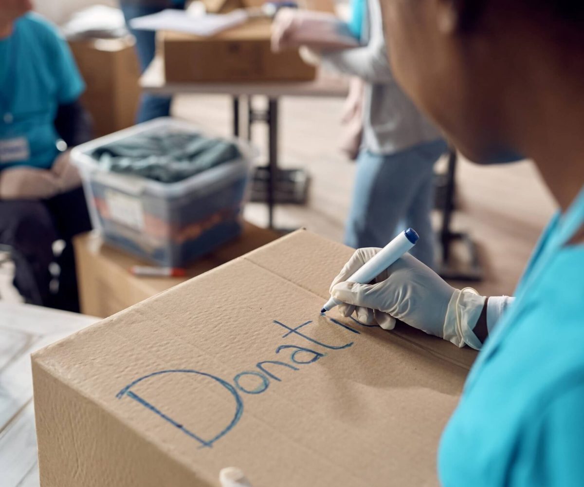 close up of woman marking donation boxes while vol 2022 11 16 14 40 42 utc.jpg