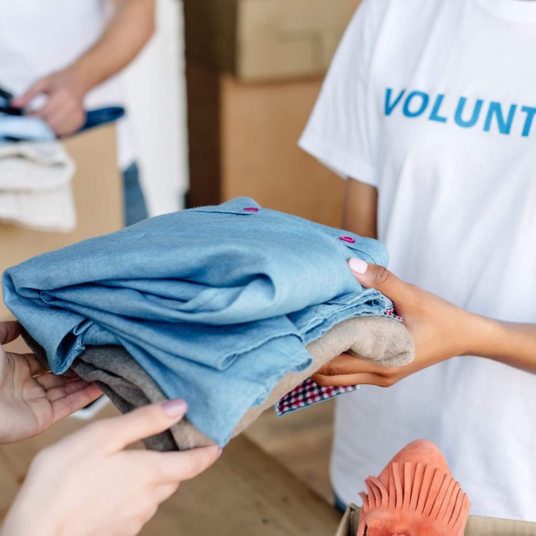 cropped view of volunteer giving clothes to woman 2022 12 16 21 31 45 utc.jpg